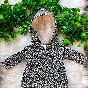 Carter's animal print fleece jacket with hood.   3 goldstone glitter buttons.
